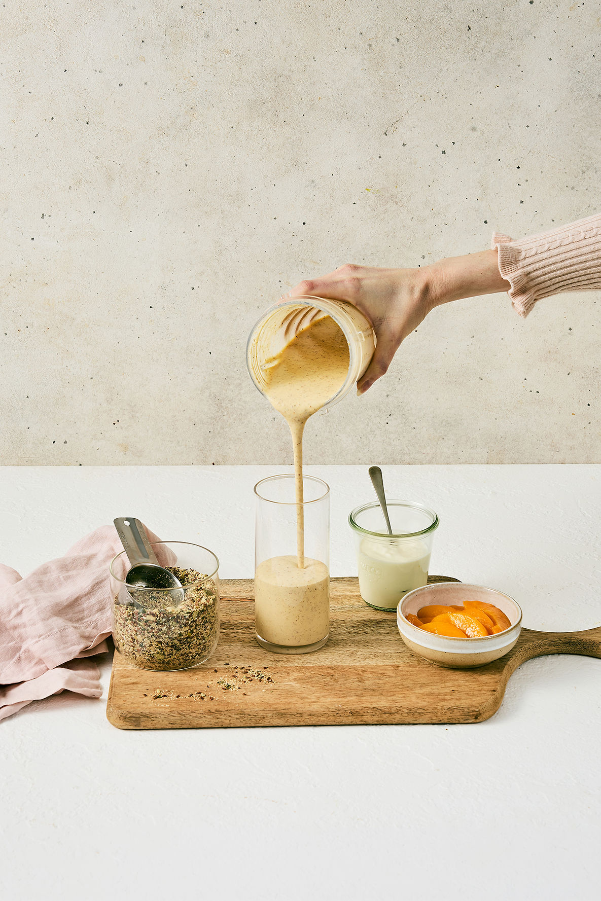 Pouring a My Daily Gut smoothie into a glass